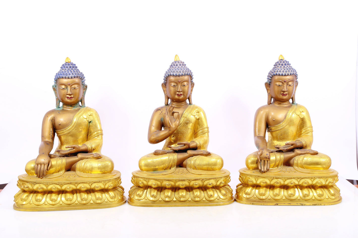 Three gilt bronze statues of Sakyamuni