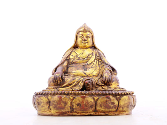 A serene gilt bronze statue of Tsongkhapa