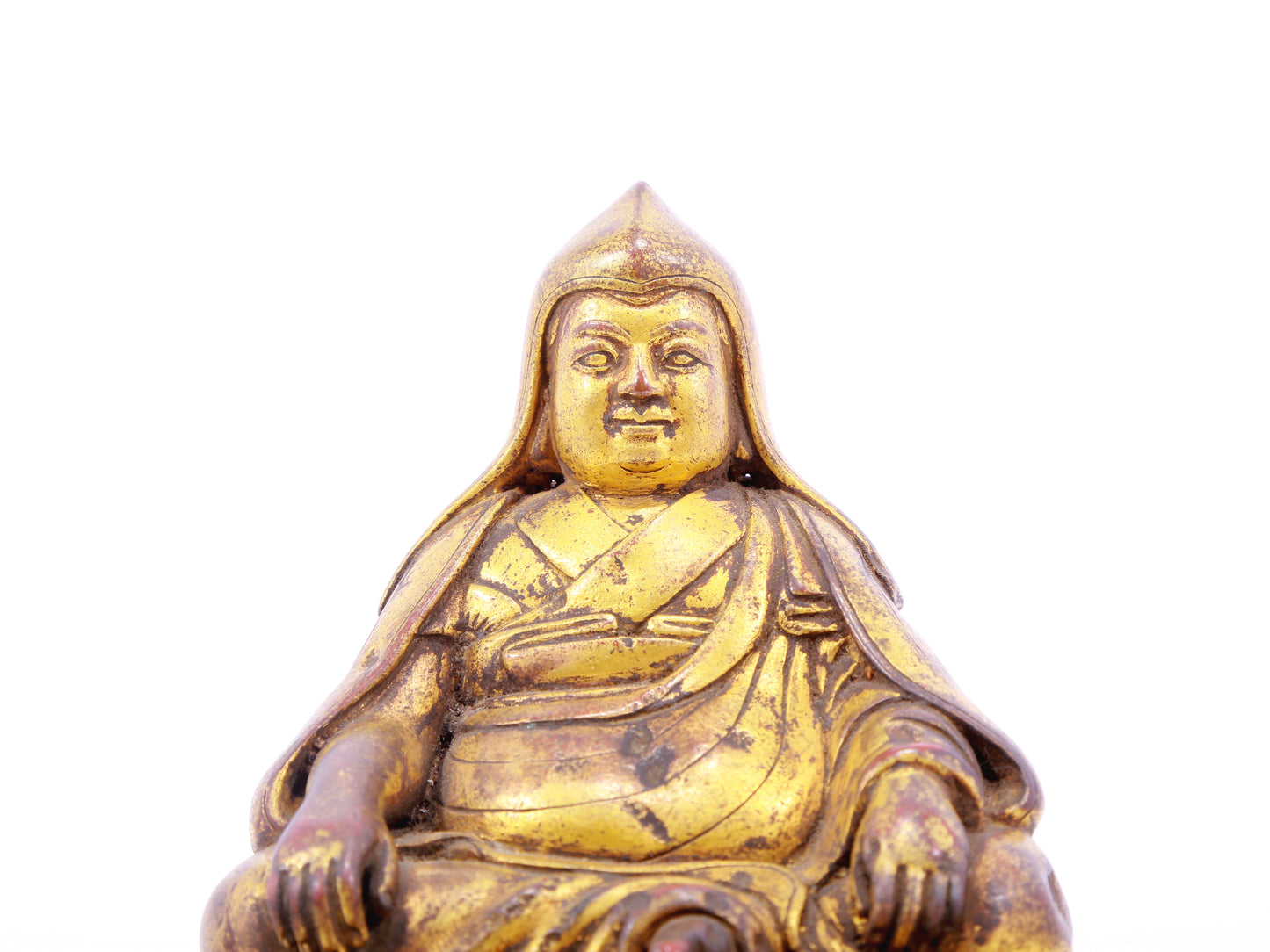 A serene gilt bronze statue of Tsongkhapa