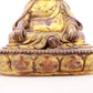 A serene gilt bronze statue of Tsongkhapa