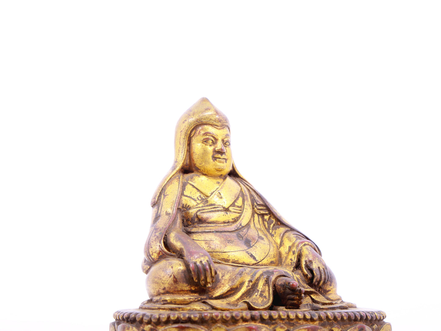 A serene gilt bronze statue of Tsongkhapa