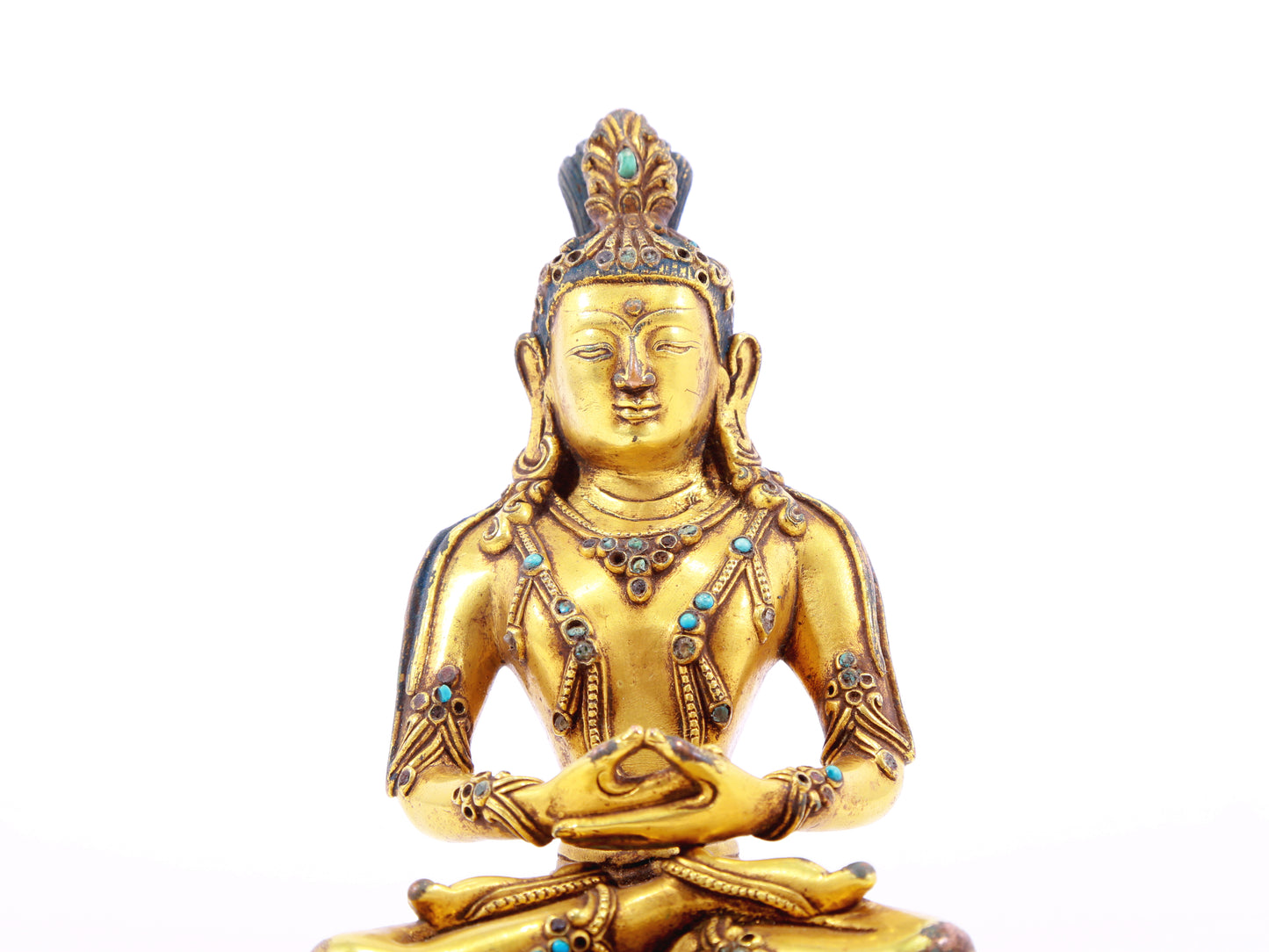 A serene gilt bronze statue of Bodhisattva inlaid with turquoise