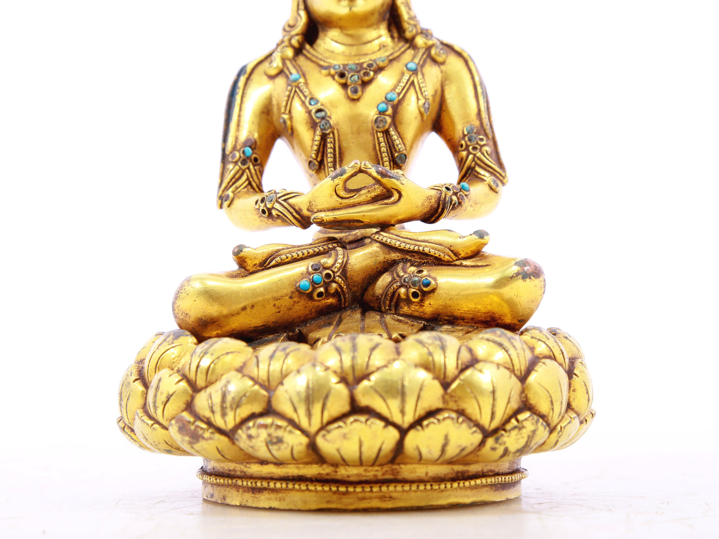 A serene gilt bronze statue of Bodhisattva inlaid with turquoise