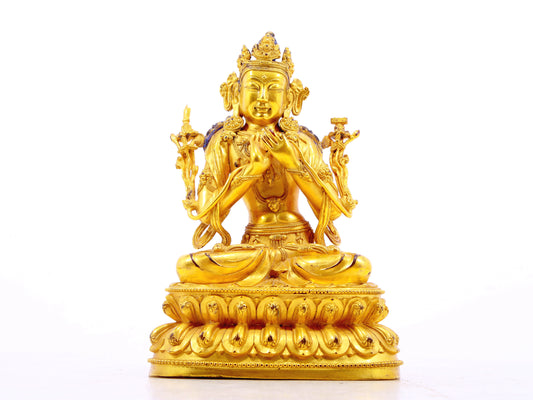 A serene gilt bronze statue of Manjushri Bodhisattva