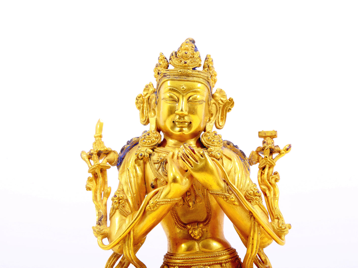 A serene gilt bronze statue of Manjushri Bodhisattva