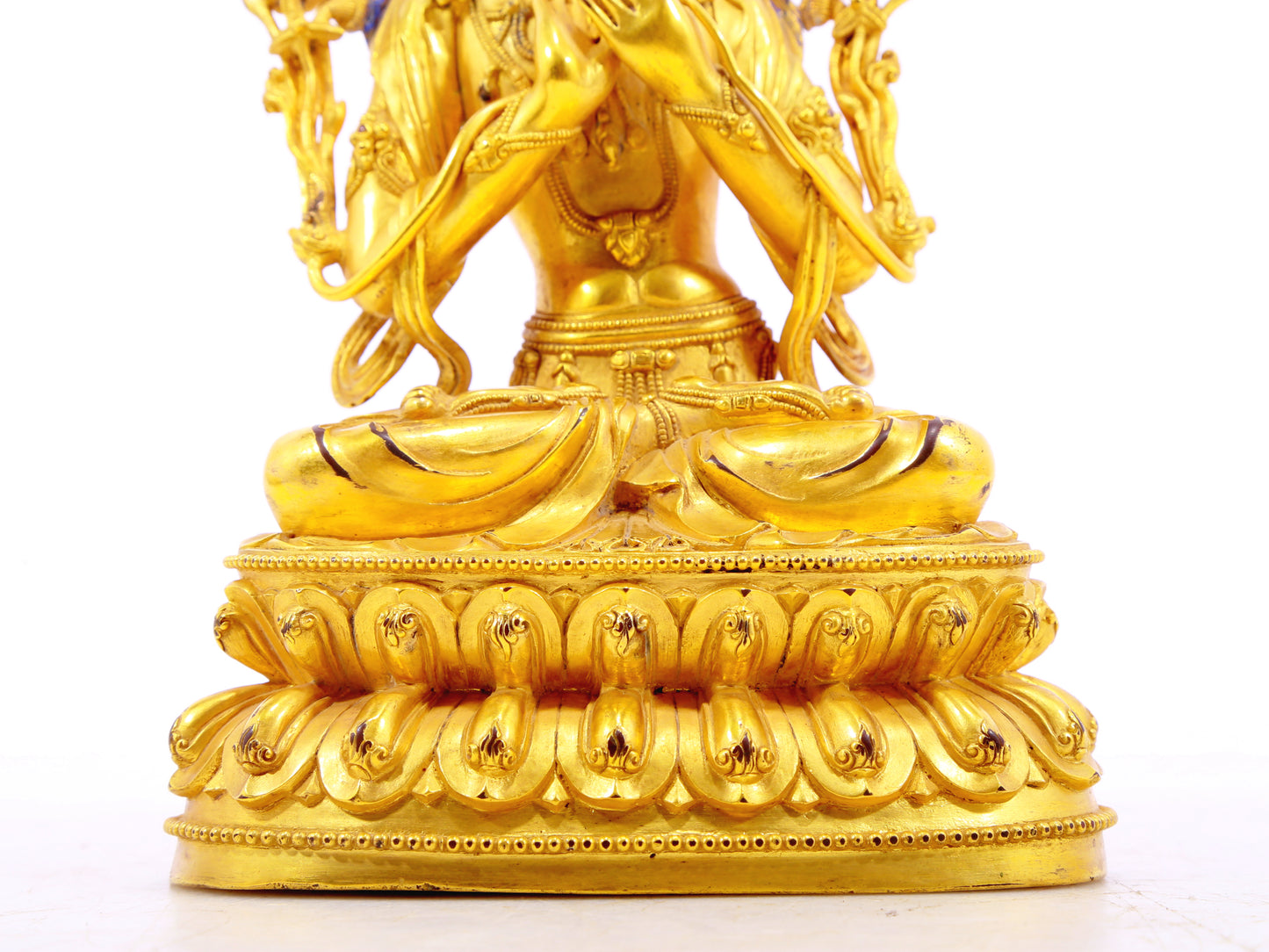 A serene gilt bronze statue of Manjushri Bodhisattva