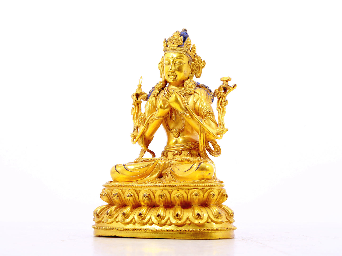 A serene gilt bronze statue of Manjushri Bodhisattva