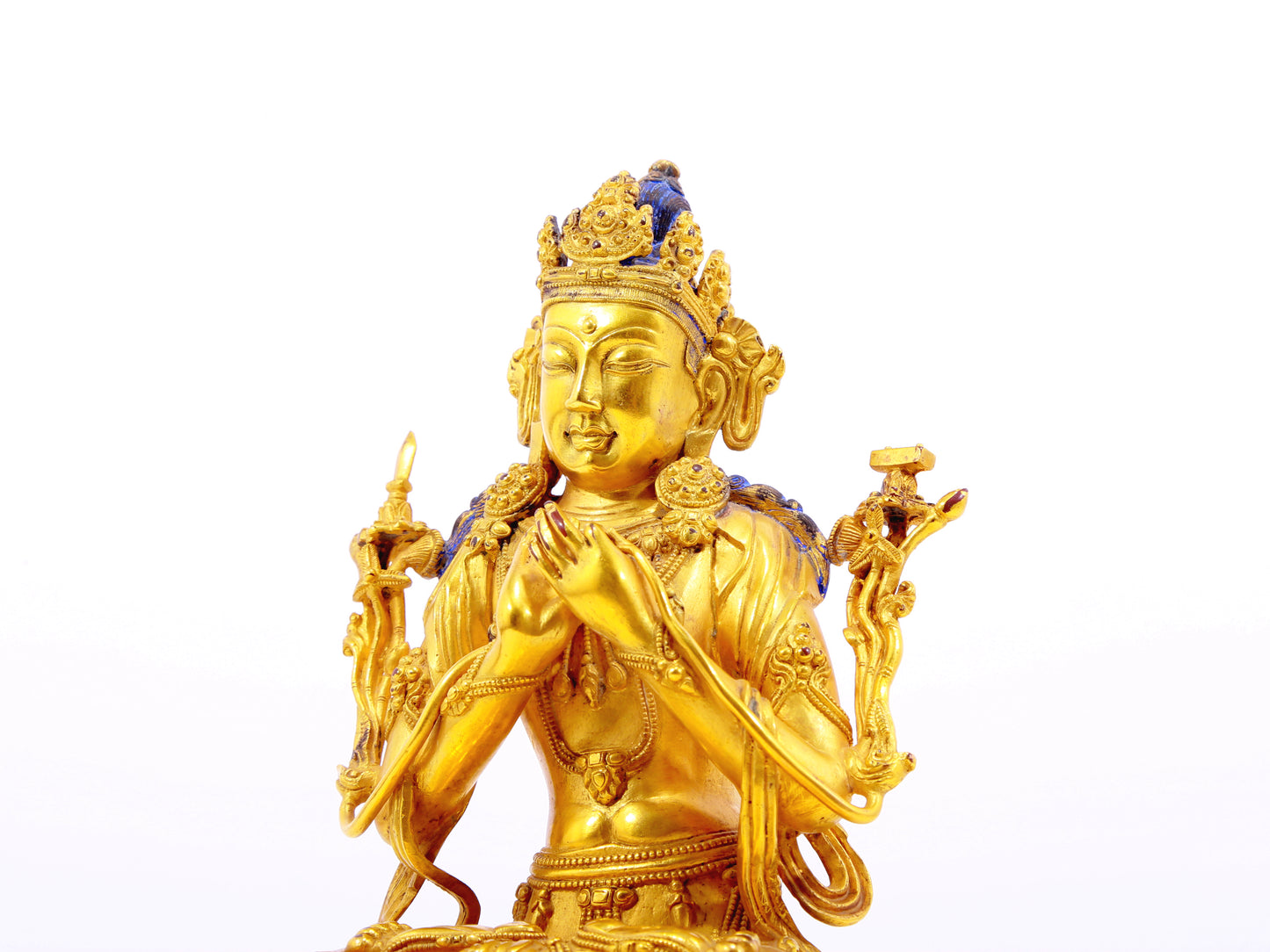 A serene gilt bronze statue of Manjushri Bodhisattva