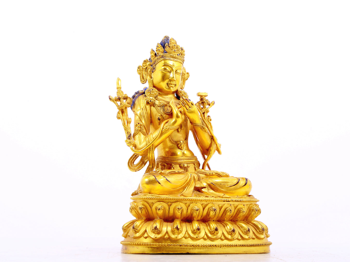 A serene gilt bronze statue of Manjushri Bodhisattva