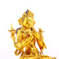 A serene gilt bronze statue of Manjushri Bodhisattva