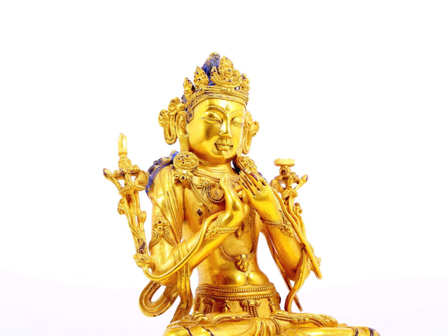 A serene gilt bronze statue of Manjushri Bodhisattva