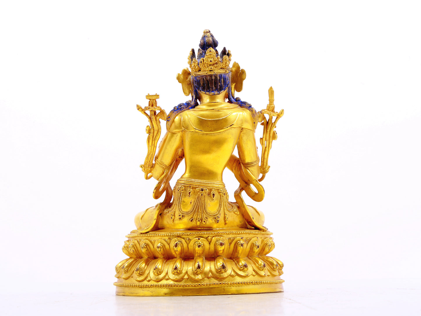 A serene gilt bronze statue of Manjushri Bodhisattva