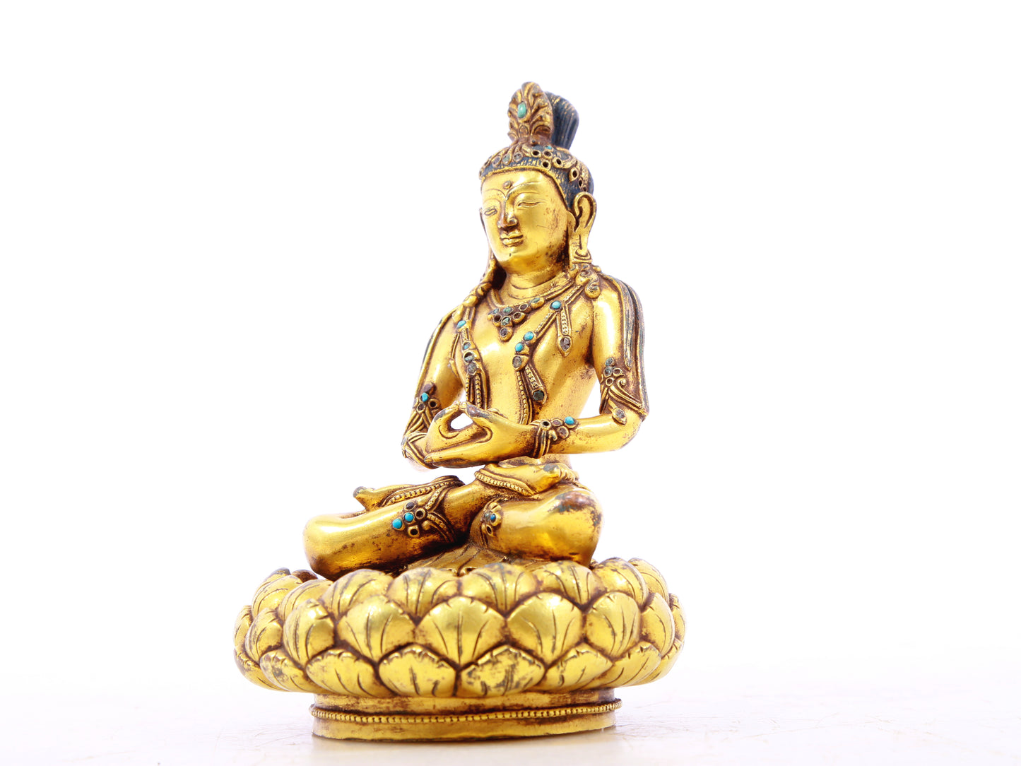 A serene gilt bronze statue of Bodhisattva inlaid with turquoise