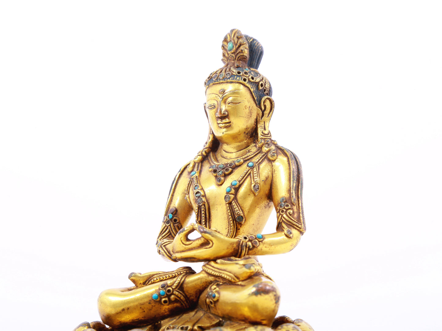 A serene gilt bronze statue of Bodhisattva inlaid with turquoise