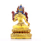 A serene gilt bronze statue of green Tara