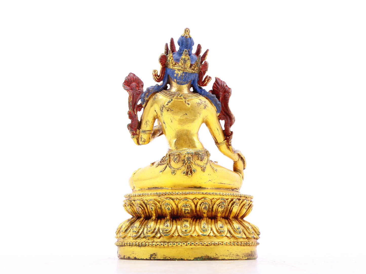 A serene gilt bronze statue of green Tara