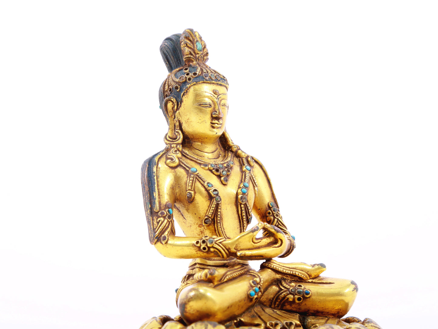 A serene gilt bronze statue of Bodhisattva inlaid with turquoise