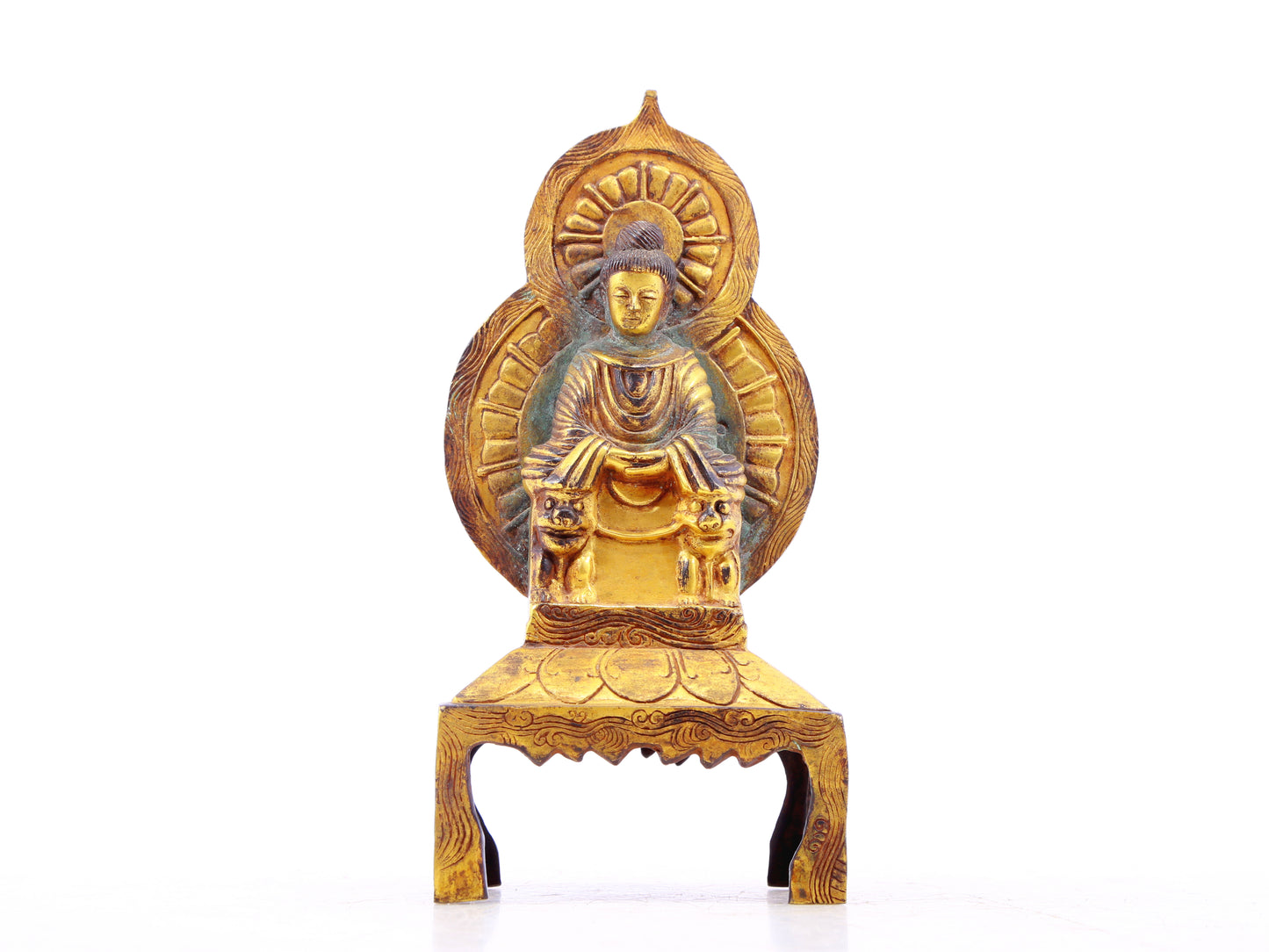 A serene gilt bronze statue of Gautama Buddha