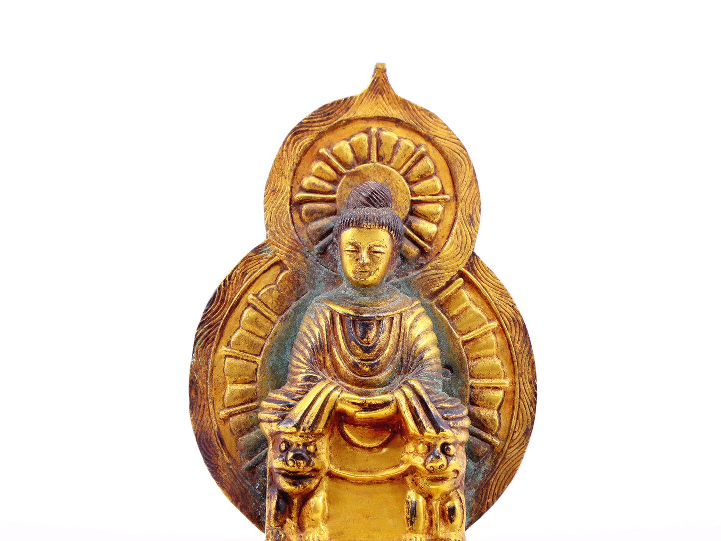 A serene gilt bronze statue of Gautama Buddha