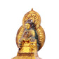 A serene gilt bronze statue of Gautama Buddha