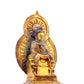 A serene gilt bronze statue of Gautama Buddha