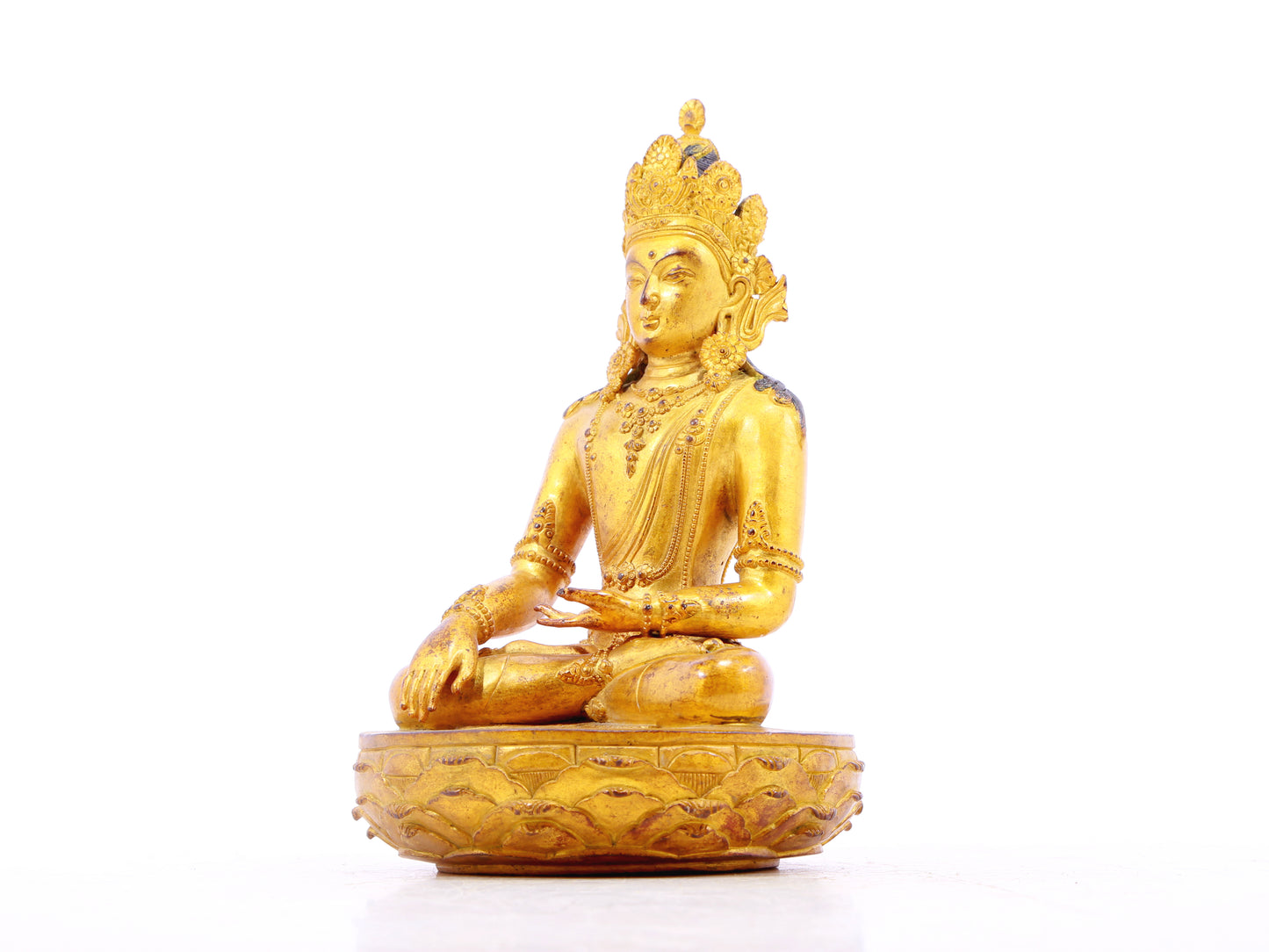 A serene gilt bronze statue of Bodhisattva