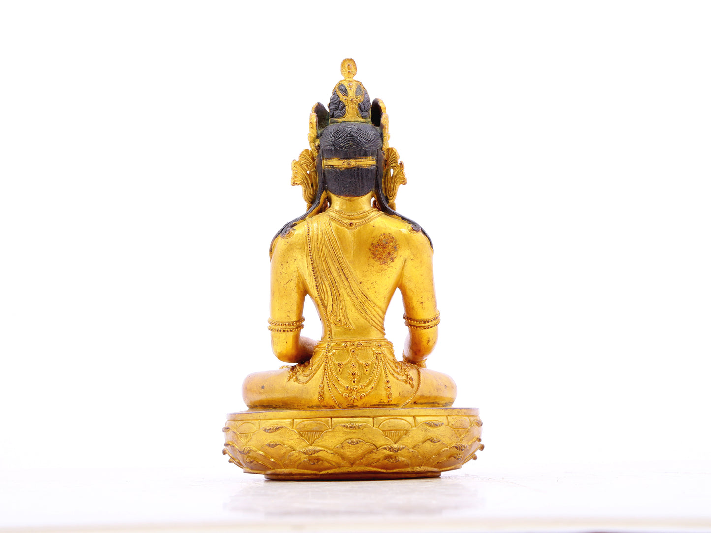 A serene gilt bronze statue of Bodhisattva