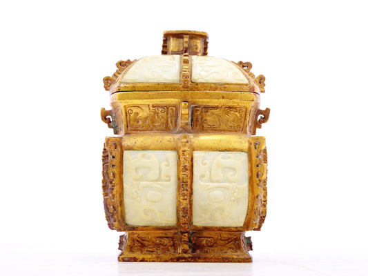 An exquisite bronze jar inlaid with white jade with animal mask patterns