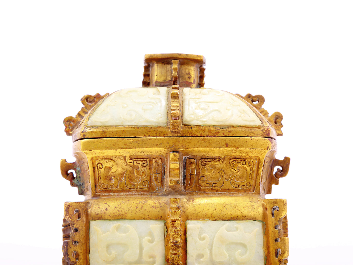 An exquisite bronze jar inlaid with white jade with animal mask patterns