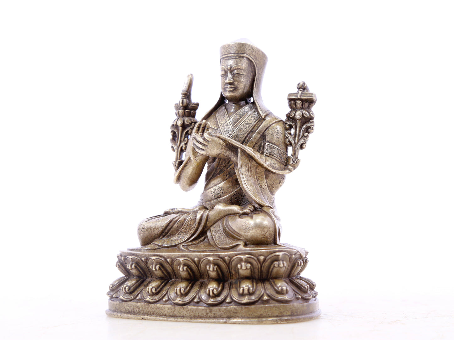 A serene gilt bronze statue of Tsongkhapa