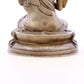 A serene gilt bronze statue of Tsongkhapa