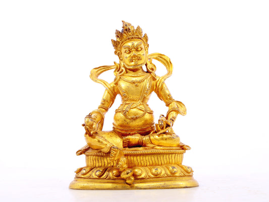 A serene gilt bronze statue of the God of Wealth