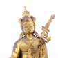 A serene gilt bronze statue of Padmasambhava