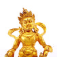 A serene gilt bronze statue of the God of Wealth