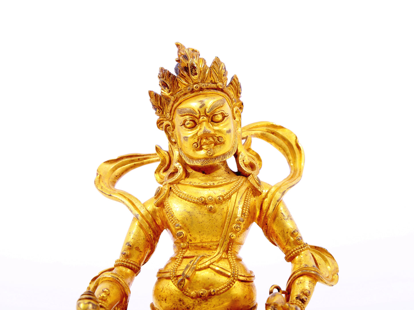 A serene gilt bronze statue of the God of Wealth