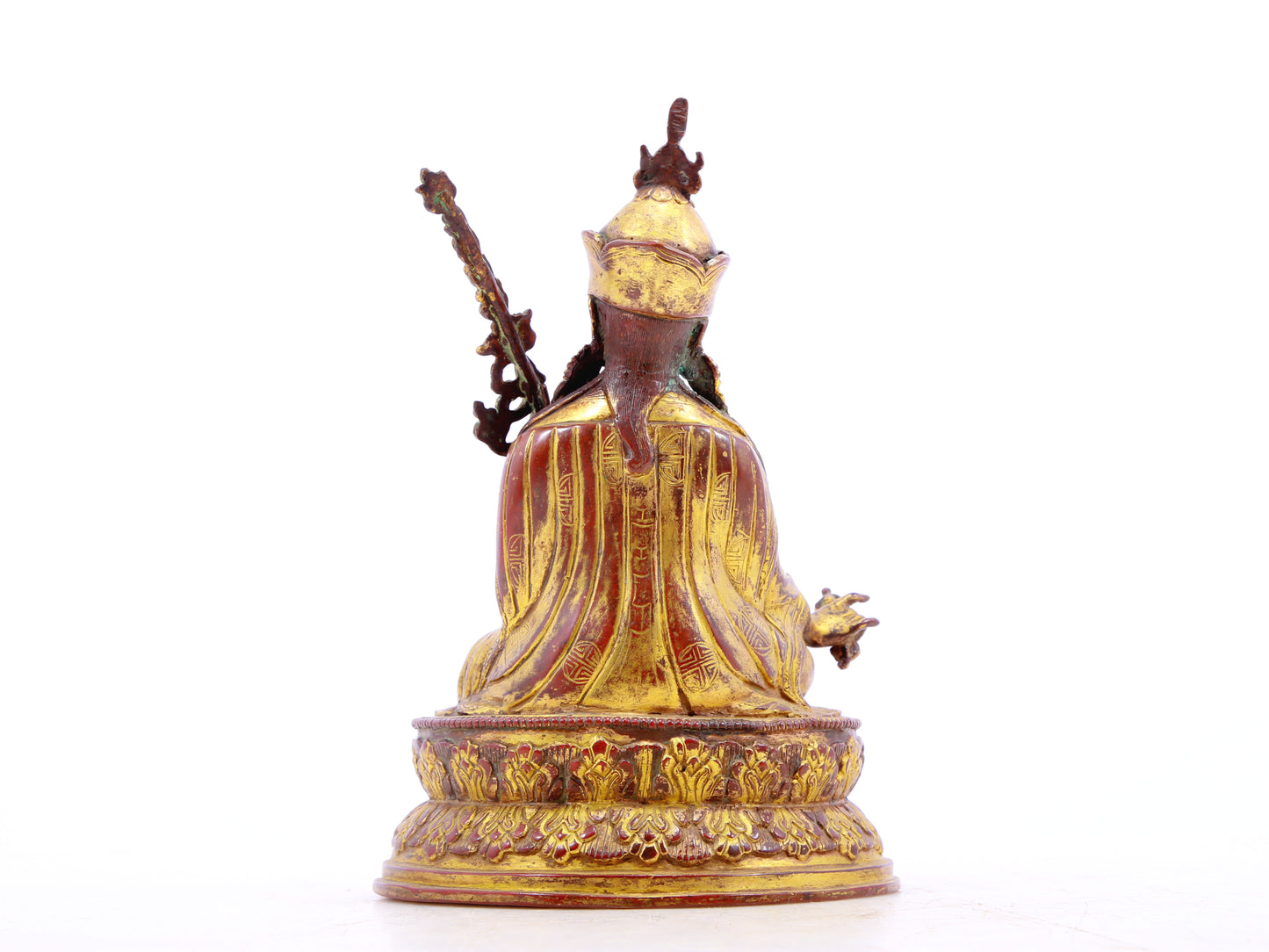 A serene gilt bronze statue of Padmasambhava