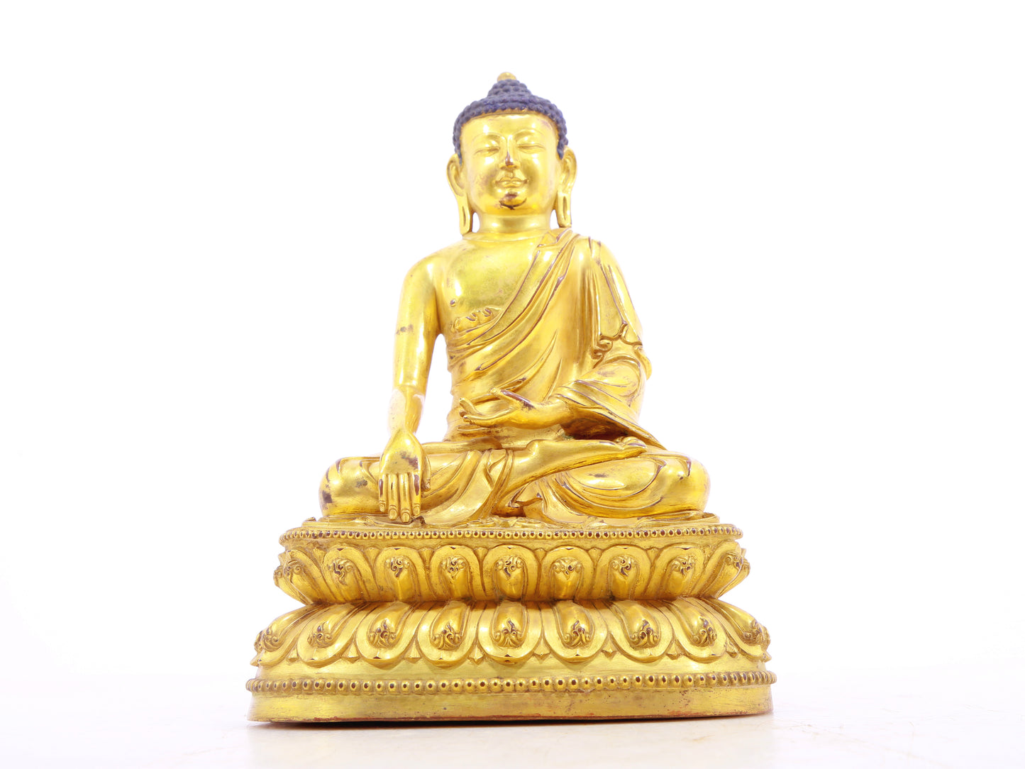 A solemn alloy bronze Gautama Buddha