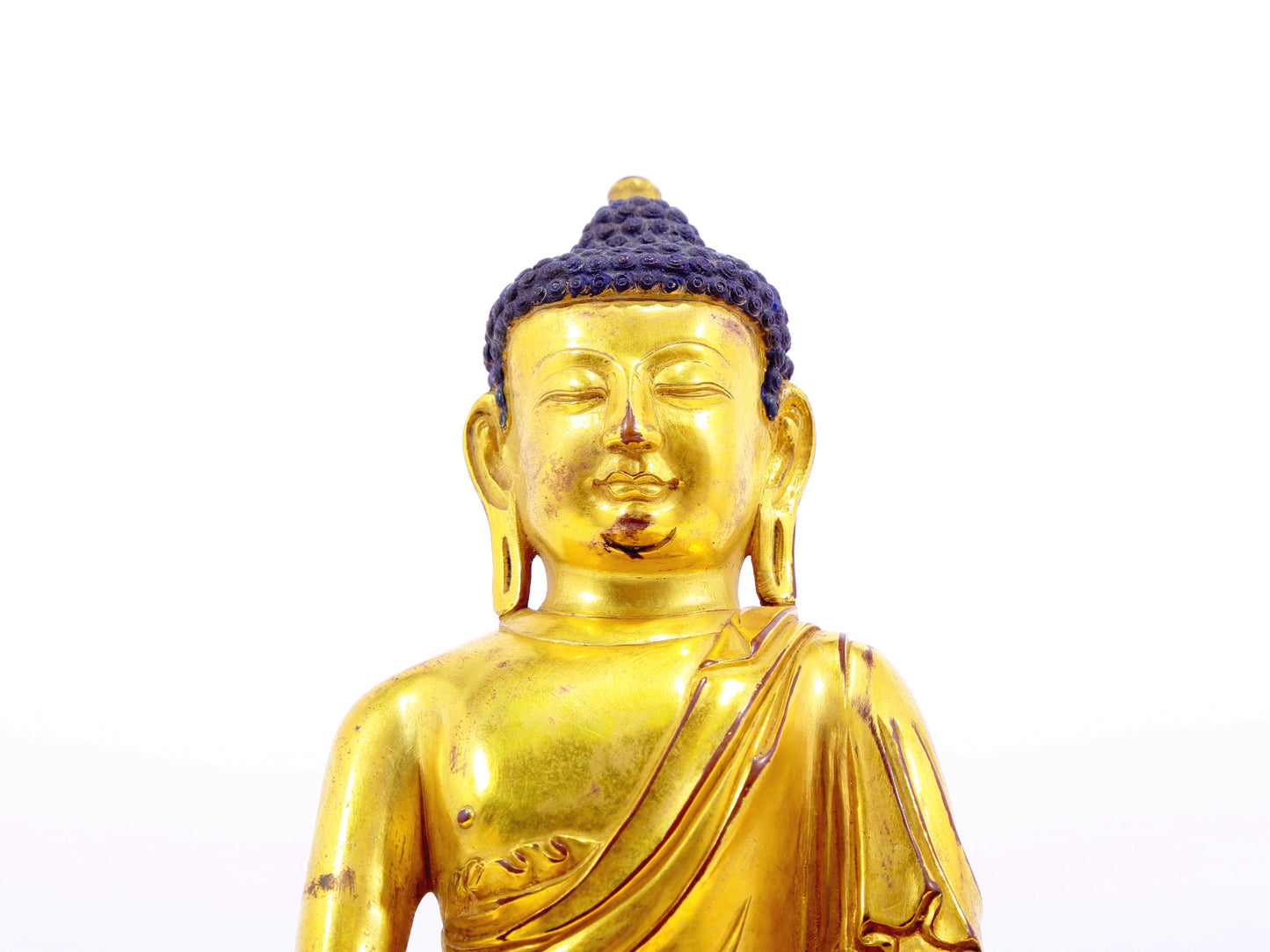 A solemn alloy bronze Gautama Buddha