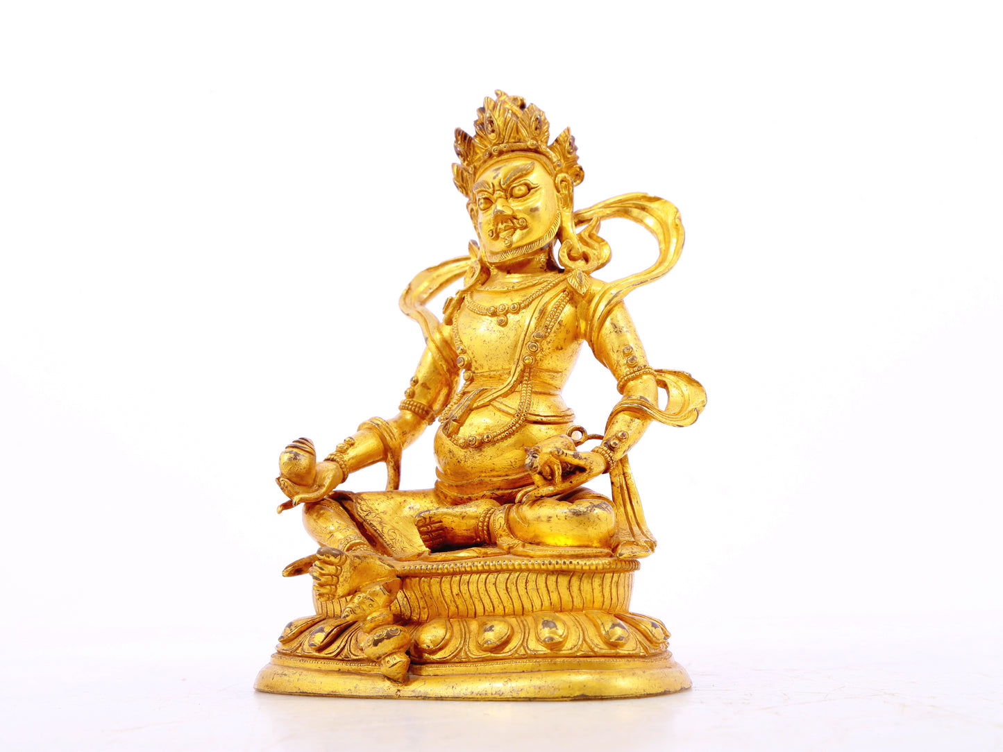 A serene gilt bronze statue of the God of Wealth