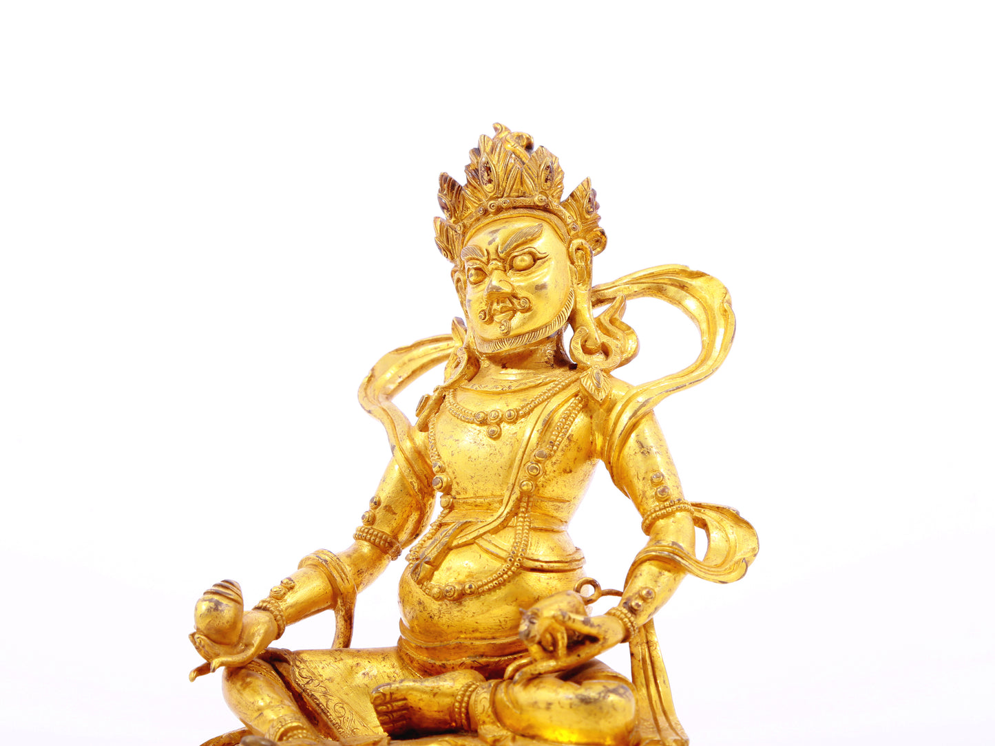 A serene gilt bronze statue of the God of Wealth