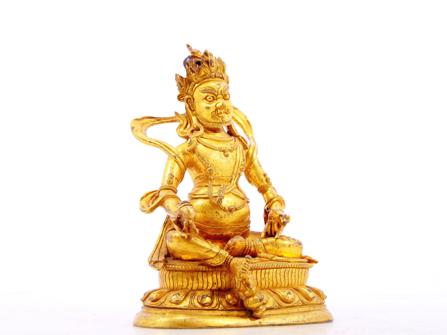 A serene gilt bronze statue of the God of Wealth