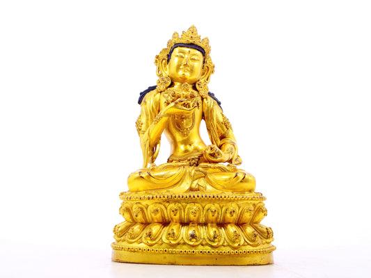 A solemn gilt bronze statue of Vajrasattva