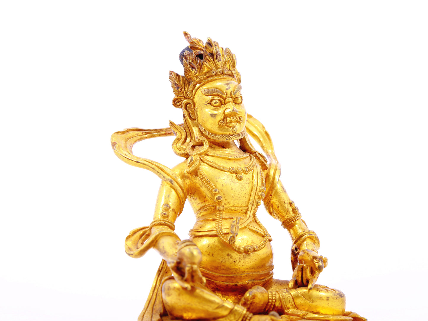 A serene gilt bronze statue of the God of Wealth