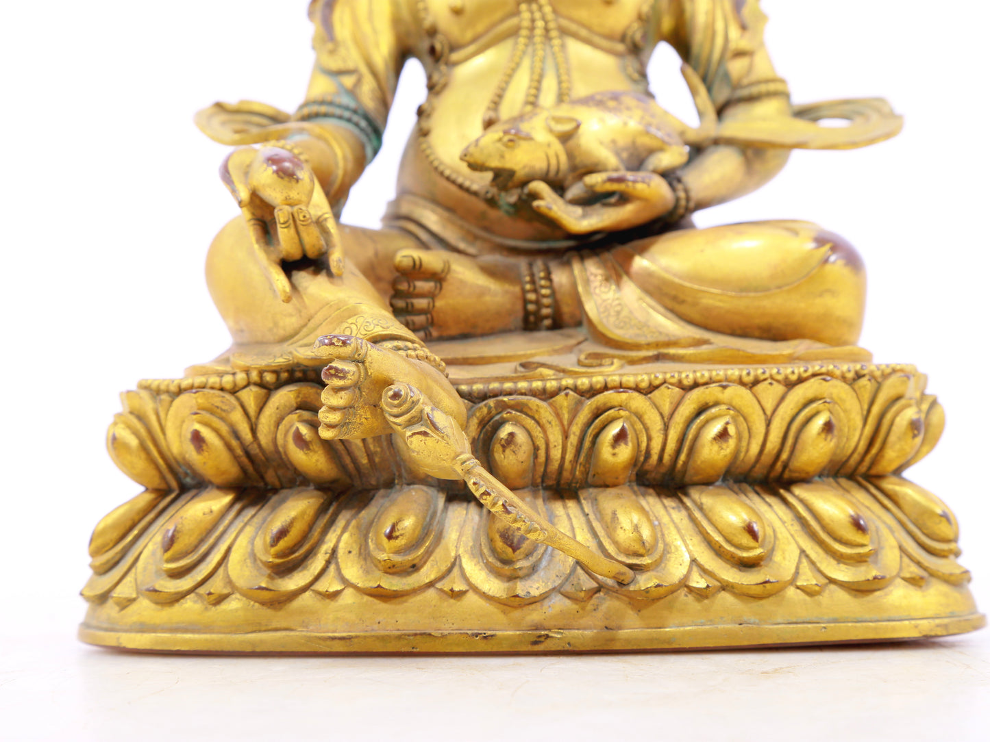 A solemn gilt bronze statue of the God of Wealth