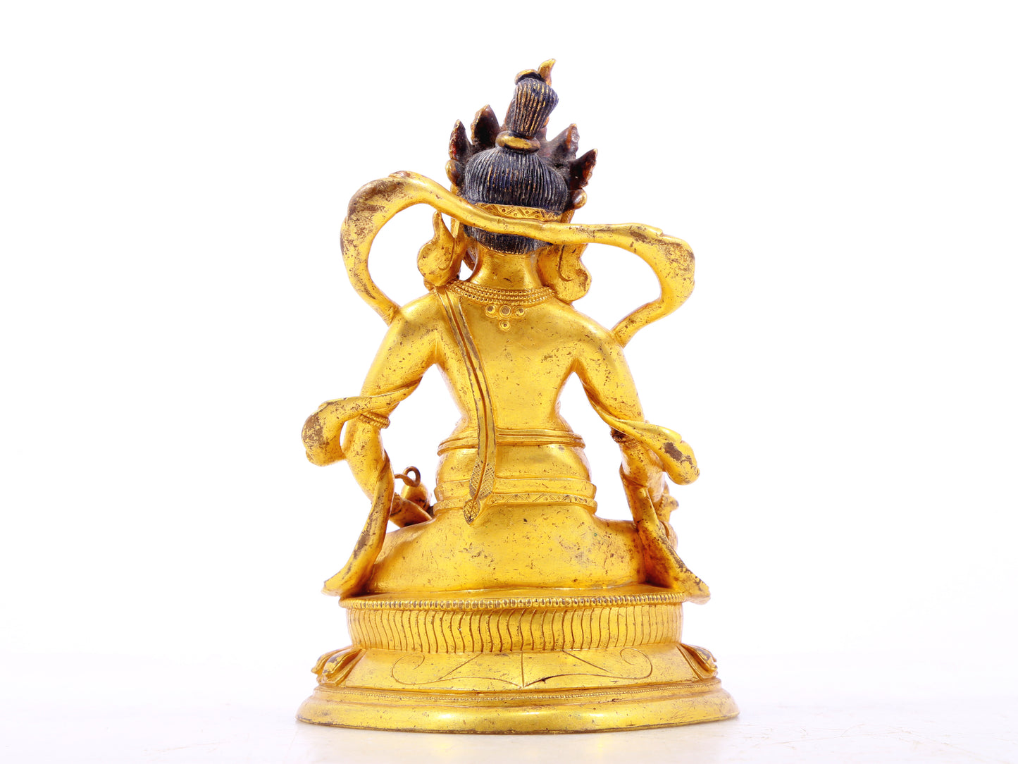 A serene gilt bronze statue of the God of Wealth