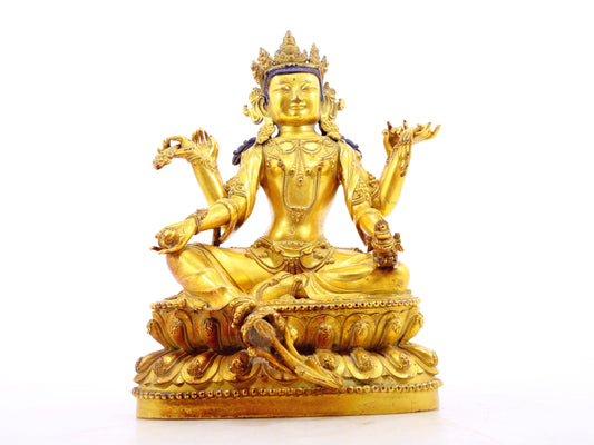 A solemn gilt bronze six-armed Guanyin statue