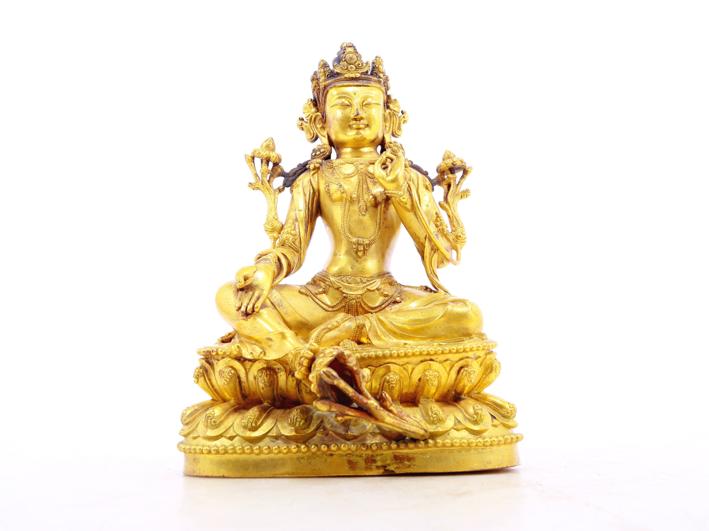 A solemn gilt bronze statue of Tara