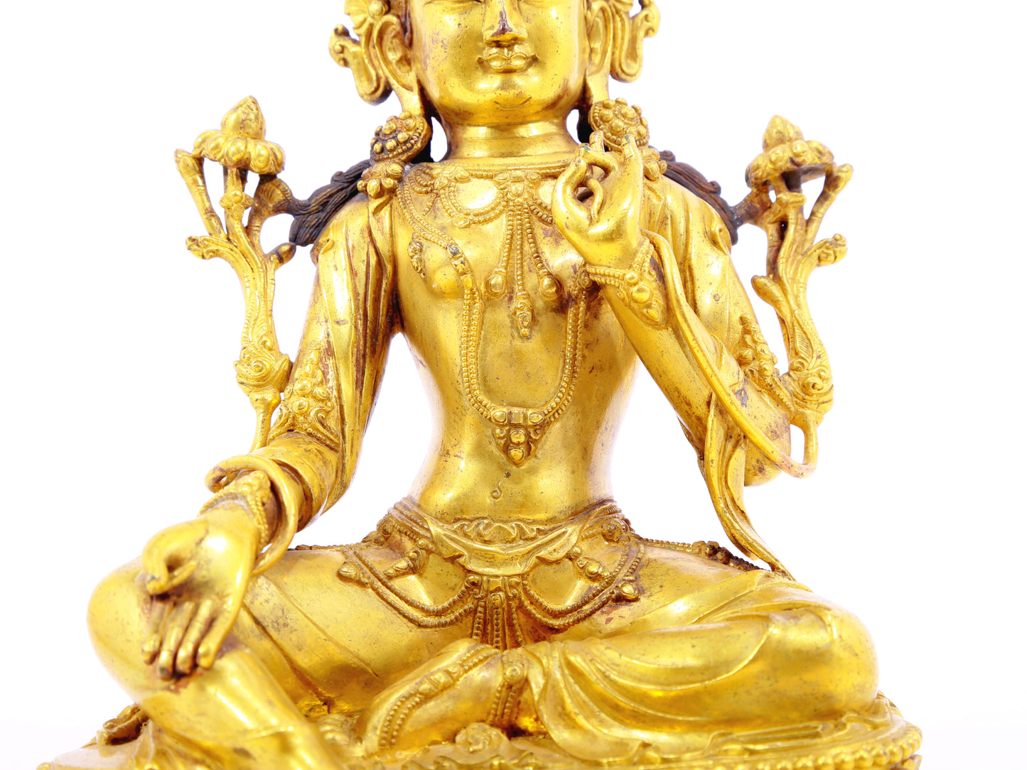 A solemn gilt bronze statue of Tara