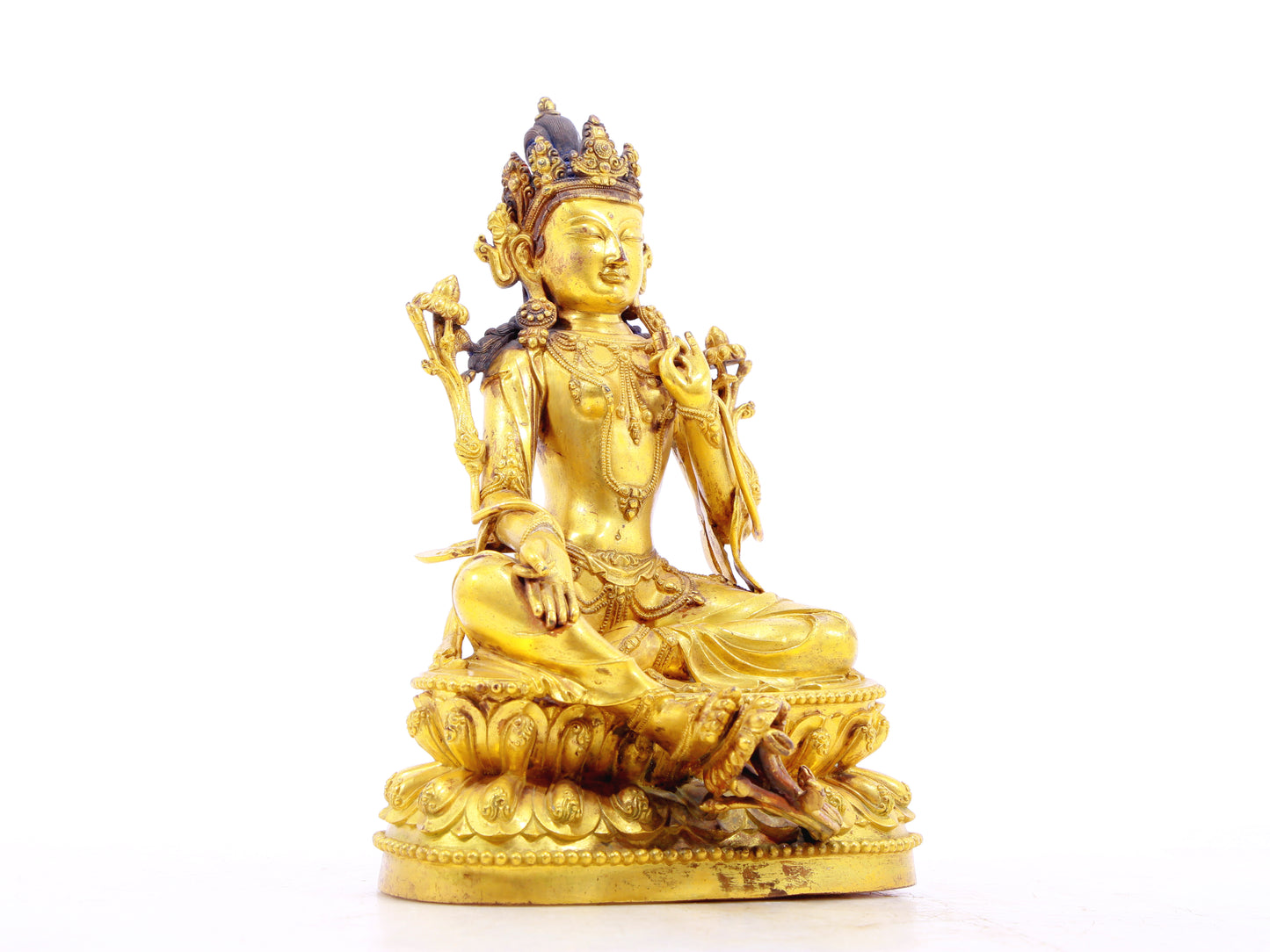 A solemn gilt bronze statue of Tara