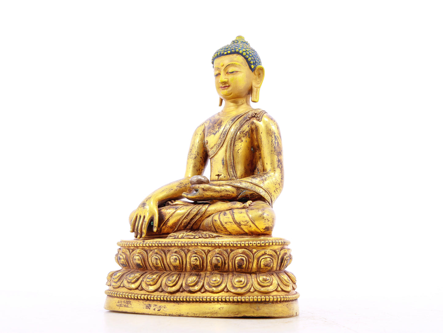 A solemn alloy bronze Gautama Buddha